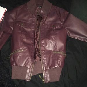 Maroon leather jacket.